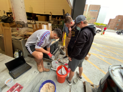 Students mixing concrete