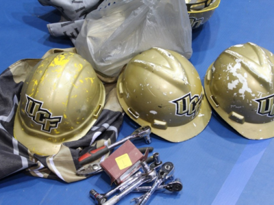 Hard hats and tools with the ucf logo