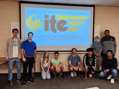 group of students in front of screen with ITE logo