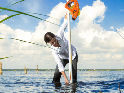 Kelly Kibler stands in water