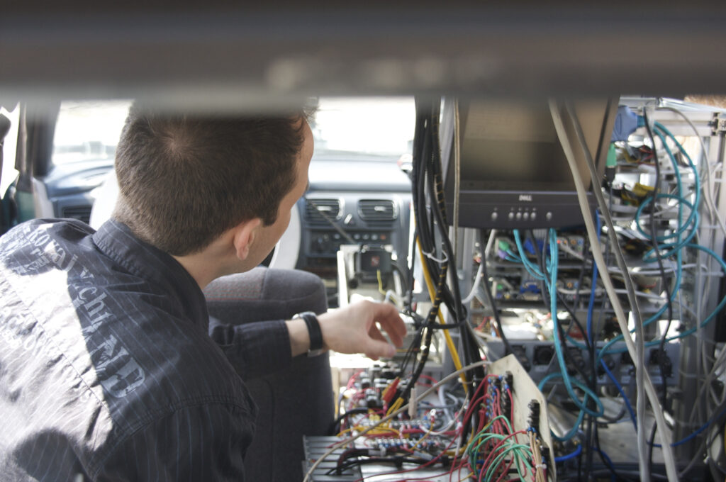 Student working on car