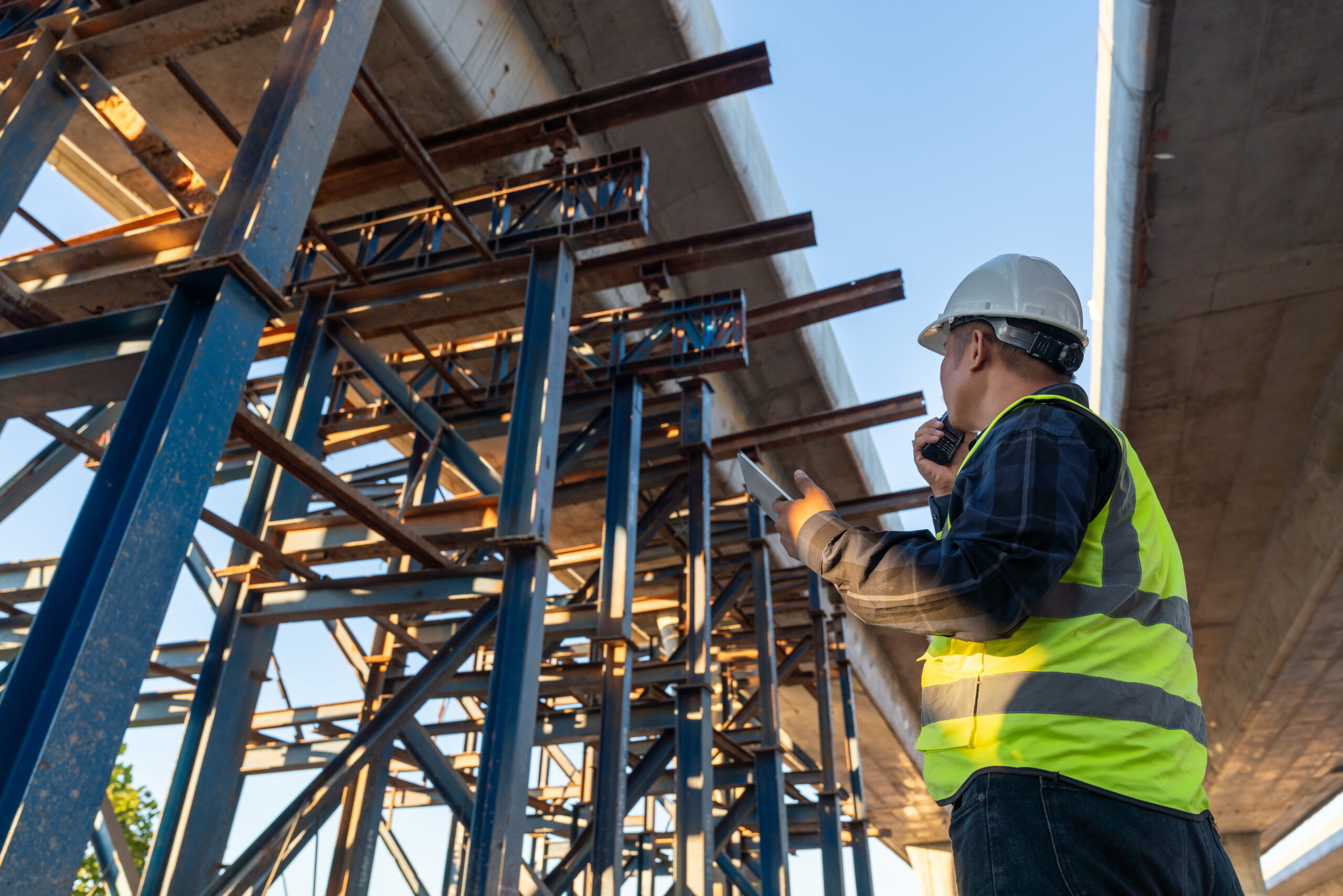 engineer looking up at a structure