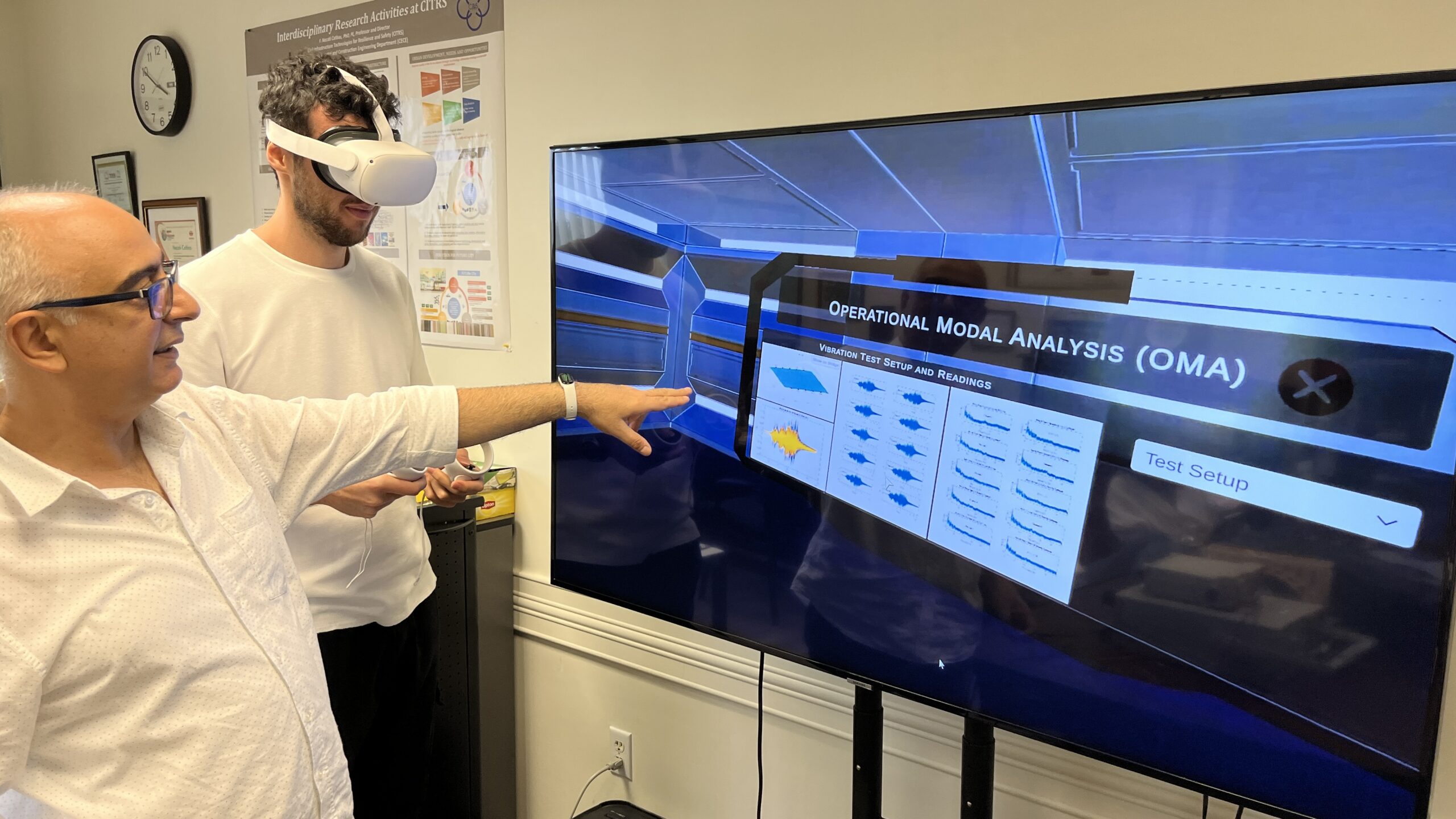 Necati Catbas points to a virtual reality screen