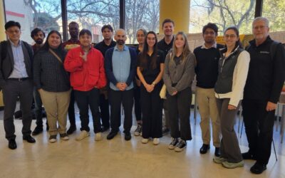 A group of students and faculty at a research conference